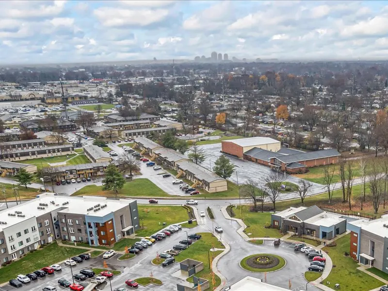 Aerial view from The Bend looking toward the downtown Louisville skyline on the horizon
